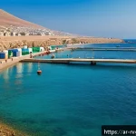 해양 재생에너지의 지역적 특성 연구 - A vibrant coastal village in North Africa featuring a modern marine renewable energy wave power stat...